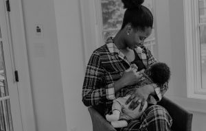 Black mother nursing baby