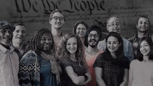 Diverse group of citizens in front of constitution background