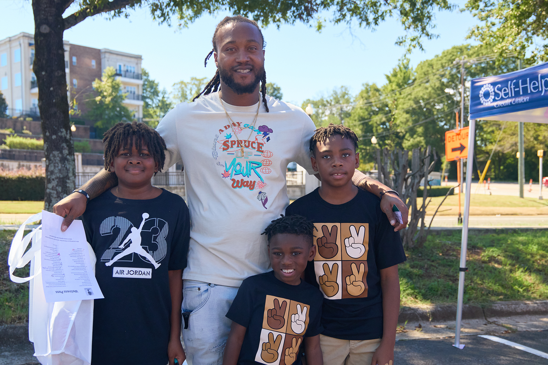 Father and his sons attend Rooted in Wellness Day event in Durham