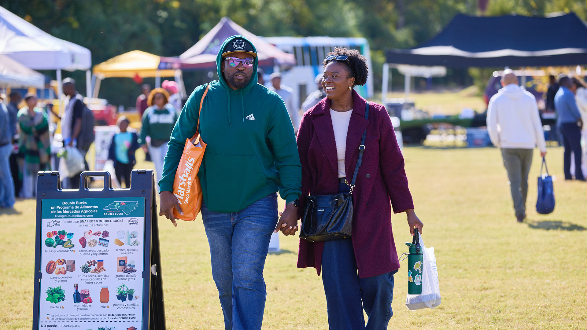 A couple shops during the Harvest Market Festival at the Southeast Raleigh YMCA Oct. 26, 2025.